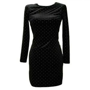 Black velvet with gold studding. Mid length, half sleeve, round neck line.